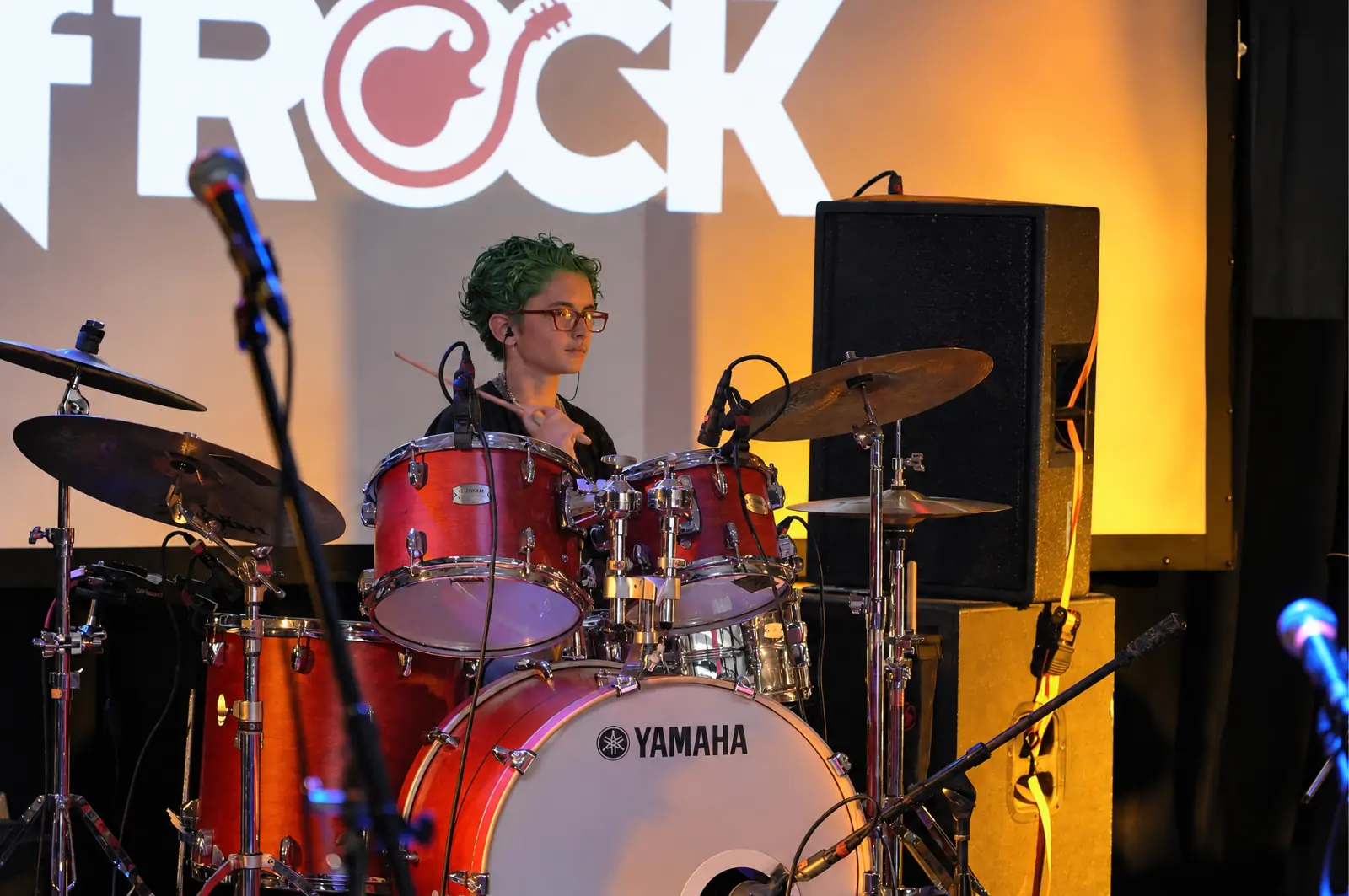 Leonidas Cantrell playing a red Yamaha drum kit at the Albatross in Jacksonville.